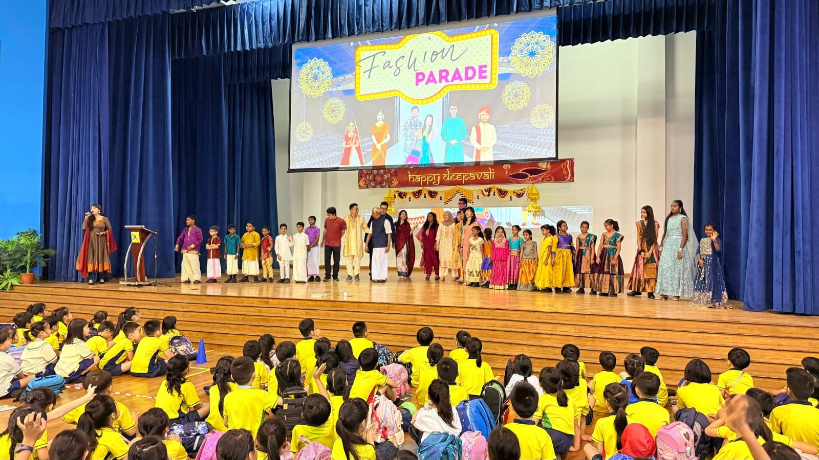 Students and teachers on stage as they participated in a Fashion Parade